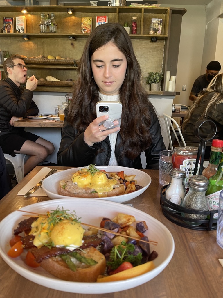 Girl Taking Picture of Food